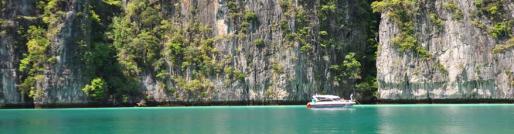 boat along cliffs